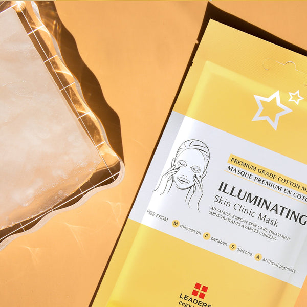 Bright yellow packaging of Illuminating Skin Clinic Mask | Leaders with a cold gel pack on a light background, highlighting skincare and spa treatment essentials.