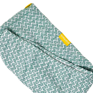 Green and white patterned microfiber hair turban with a yellow tag, designed for skincare and wellness, named Microfiber Hair Turban | Popmask.