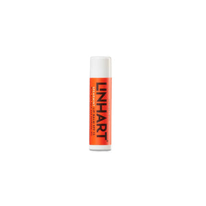 Lip Balm SPF 15 | LINHART in a bright orange tube designed for moisturizing and protecting lips with a spearmint scent, ideal for skincare and wellness.