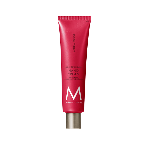 Tube of Hand Cream | Moroccanoil in red packaging with silver cap featuring nourishing formula with argan oil and hyaluronic acid for skincare and body care.