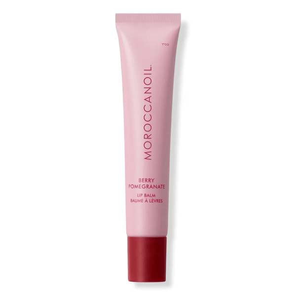 Argan Butter Lip Balm | Moroccanoil in a pink tube with red cap, featuring a berry pomegranate scent designed for skincare and lip hydration.