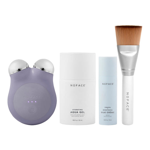 MINI+ Starter Kit | NuFACE featuring a violet skincare device, hydrating aqua gel, firming silk crème, and a soft-bristle applicator brush for facial wellness and body care.