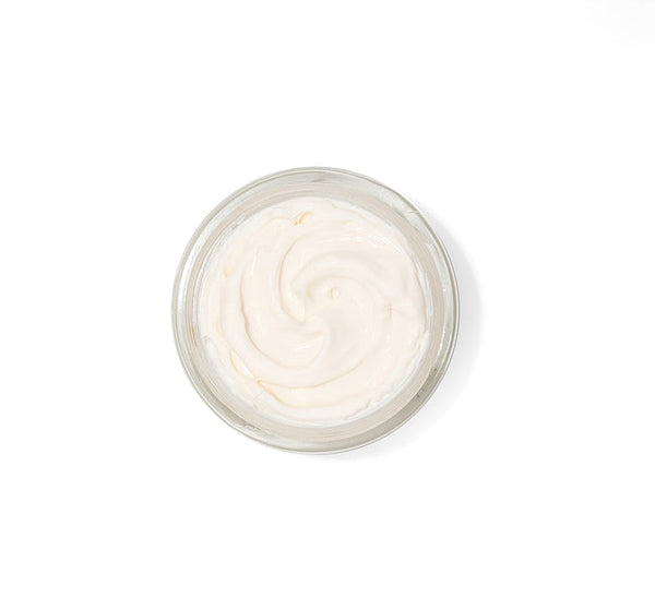 Open jar of creamy white skincare product with smooth texture, representing Necks-Level Smooth™ Cream | Farmhouse Fresh designed for neck care and wellness.