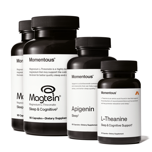 Four black supplement bottles labeled Momentous including Magtein, Apigenin, and L-Theanine arranged in a row promoting Nightly Sleep Stack for sleep and cognitive support.