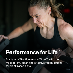 Woman in athletic wear focused intensely while using exercise equipment, promoting wellness and recovery with The Momentous Three plant-based supplements.