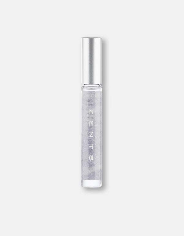 Clear glass roll-on bottle with silver cap containing a light purple fragrance labeled Attar Roll-on Scent | Zents for personal wellness and body care.
