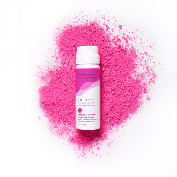 Bottle of Preheels+ Blister Prevention Spray | Barefoot Scientist on a bright pink powder background, highlighting skincare and body care wellness product.