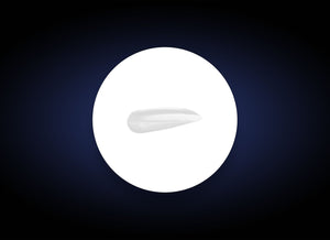 Close-up of a smooth white serum sample on a white circular background against a dark backdrop, showcasing the texture of Vitamin B3 Brightening Serum | PCA Skin for skincare use.