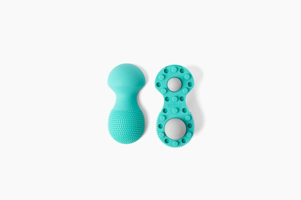 Neuro Roller | RAD wellness device in teal, featuring textured silicone surface and dual roller design for targeted body care and recovery.