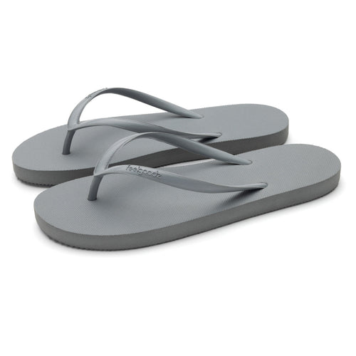Pair of simple light gray flip-flop style Slimz Core Sandals | Feelgoodz with thin straps and textured footbed designed for casual comfort.
