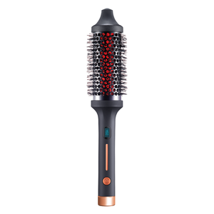 IR INFRARED Thermal Styling Brush 43MM | SUTRA with a black and rose gold handle, featuring a round barrel with bristles and a digital temperature display for precise styling.