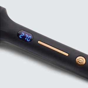 Close-up of the handle of the IR INFRARED Thermal Styling Brush 43MM | SUTRA showing the digital temperature display set at 210 degrees and control buttons on a sleek black surface.