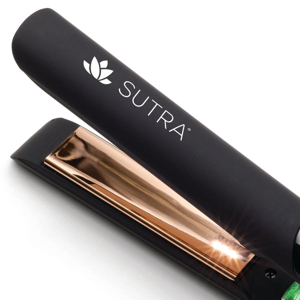 Close-up of the black and rose gold IR2 Infrared Flat Iron - 1" | SUTRA hair styling tool with sleek design for smooth, healthy hair styling.