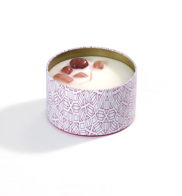 Sensual Candle Tin 6 oz | Aluminate Life featuring a decorative pink geometric patterned tin with white wax and small polished stones set on top for a soothing, spa-like ambiance.