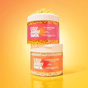 Two stacked containers of I'm Sensitive Meltdown Vegan Hard Wax | Crybaby Wax with yellow and white wax beads inside, set against a bright yellow background for skincare and body care.
