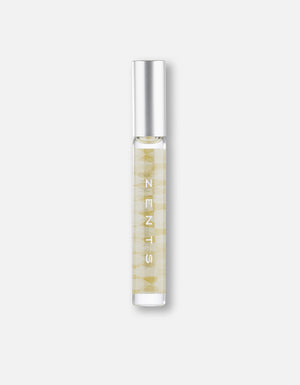 Clear glass roll-on bottle with a silver cap containing a golden liquid, featuring subtle patterns and labeled Attar Roll-on Scent | Zents for body care and wellness.