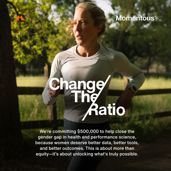 A woman jogging outdoors in a sunlit park wearing athletic clothing, illustrating the concept of improving health and performance equity, with text emphasizing Momentous’ commitment and featuring The Women’s Three™.