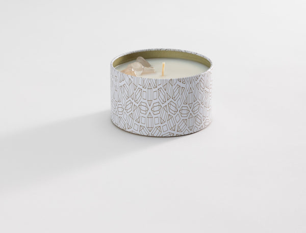 Defense Candle Tin 6 oz | Aluminate Life featuring a decorative white tin with gold geometric patterns, filled with a cream-colored candle and a single wick.