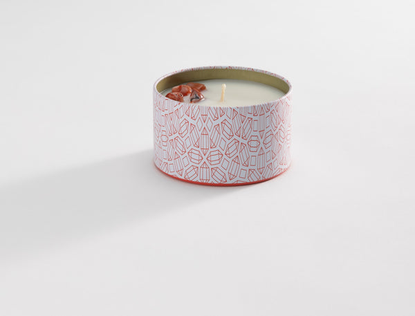 Energy Candle Tin 6 oz | Aluminate Life with a modern geometric pattern on the tin and decorative stones on the white wax surface for a calming wellness experience.