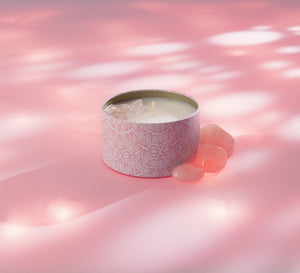 Sleep Candle Tin 6 oz | Aluminate Life in a patterned tin container with soothing pink crystals on a soft pink surface, promoting relaxation and wellness.