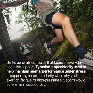 Two trail runners navigating a forested, moss-covered path during an intense workout, highlighting physical exertion and mental focus related to Tyrosine's benefits.