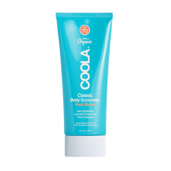 Peach Blossom Classic Body Sunscreen Lotion SPF 70 | COOLA in a blue tube, offering ultra lightweight, hydrating, and nourishing body care with broad spectrum SPF 70 protection.