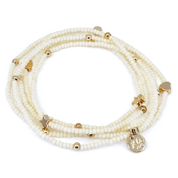 Wonder Wrap Bracelet (White Pearl & Gold Multi) | Love You More featuring delicate white pearl beads and gold accents including hearts, stars, and a charm with an elegant design.