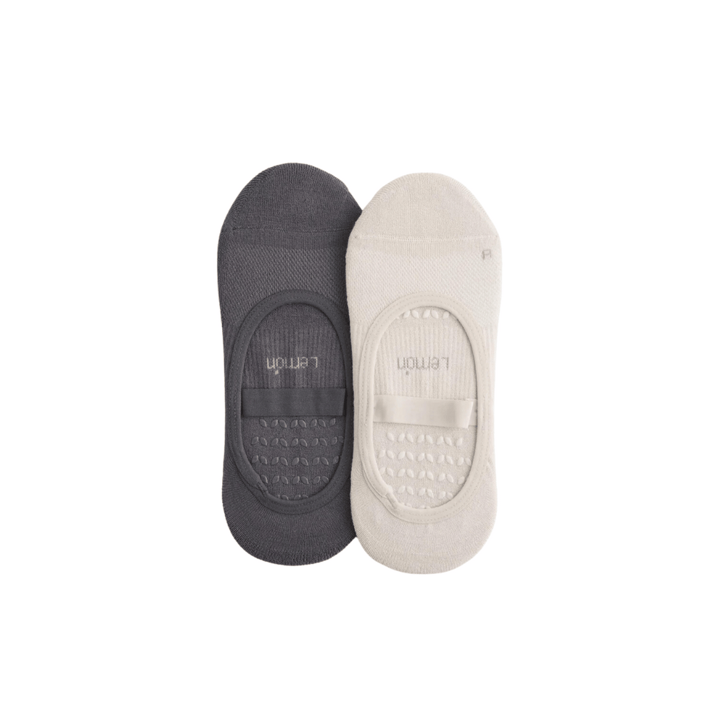 Pair of low-cut grip liner socks in dark gray and light lemon colors, designed for comfort and stability, Womens Studio Grip Liner - 2 Pack | Lemon.