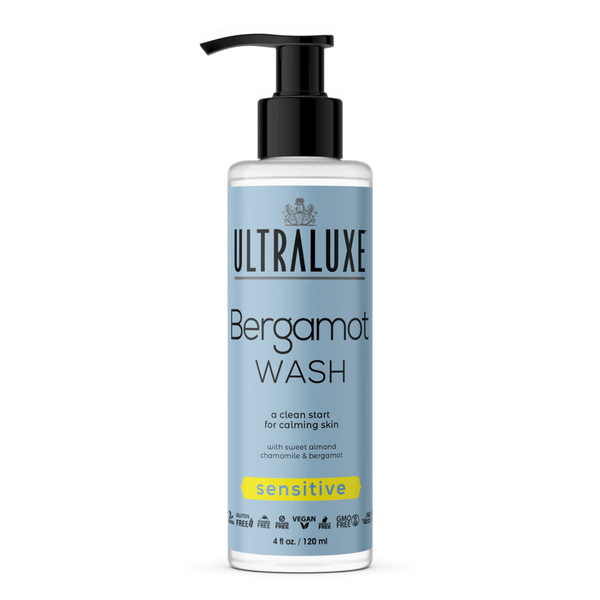 Bottle of Bergamot Wash | Ultraluxe Skincare with light blue label, black pump dispenser, designed for sensitive skin with chamomile and almond for a calming cleanse.