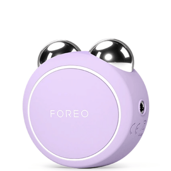 BEAR™ 2 Go | FOREO facial massage device in lavender with two polished metal spheres designed for skincare and wellness recovery tools.