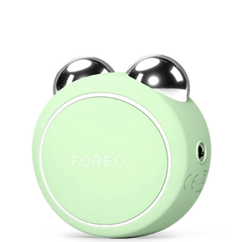 BEAR™ 2 Go | FOREO facial toning device in mint green with stainless steel spheres designed for skincare and muscle stimulation.