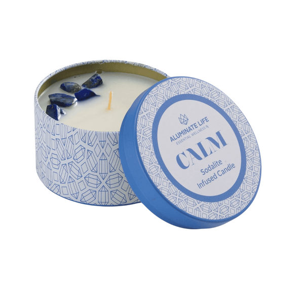 Open blue patterned tin candle labeled Calm Candle Tin 6 oz | Aluminate Life with sodalite crystals embedded in the wax for wellness and relaxation.