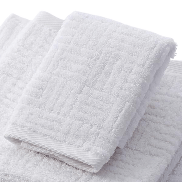 Soft white towel with textured pattern made from Hotel Collection Organic Cotton | TOWL, designed for ultimate comfort and sustainable body care.
