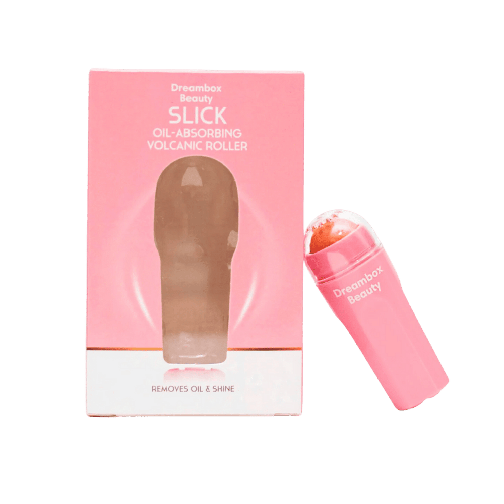 Pink packaging and roller product of Slick Oil Absorbing Volcanic Roller [Removes Oil & Shine] | Dreambox Beauty designed for skincare to reduce oil and shine on the face.