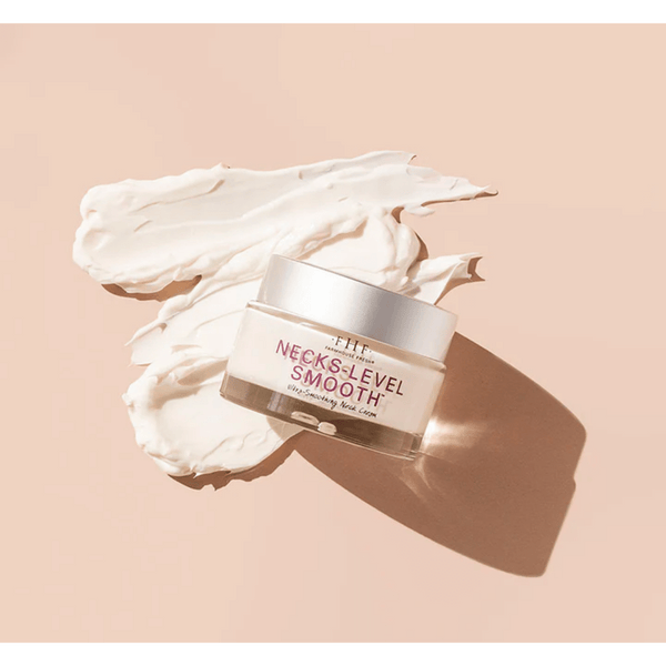 Jar of Necks-Level Smooth™ Cream | Farmhouse Fresh on a creamy textured background, highlighting smooth and rich skincare product for neck care.