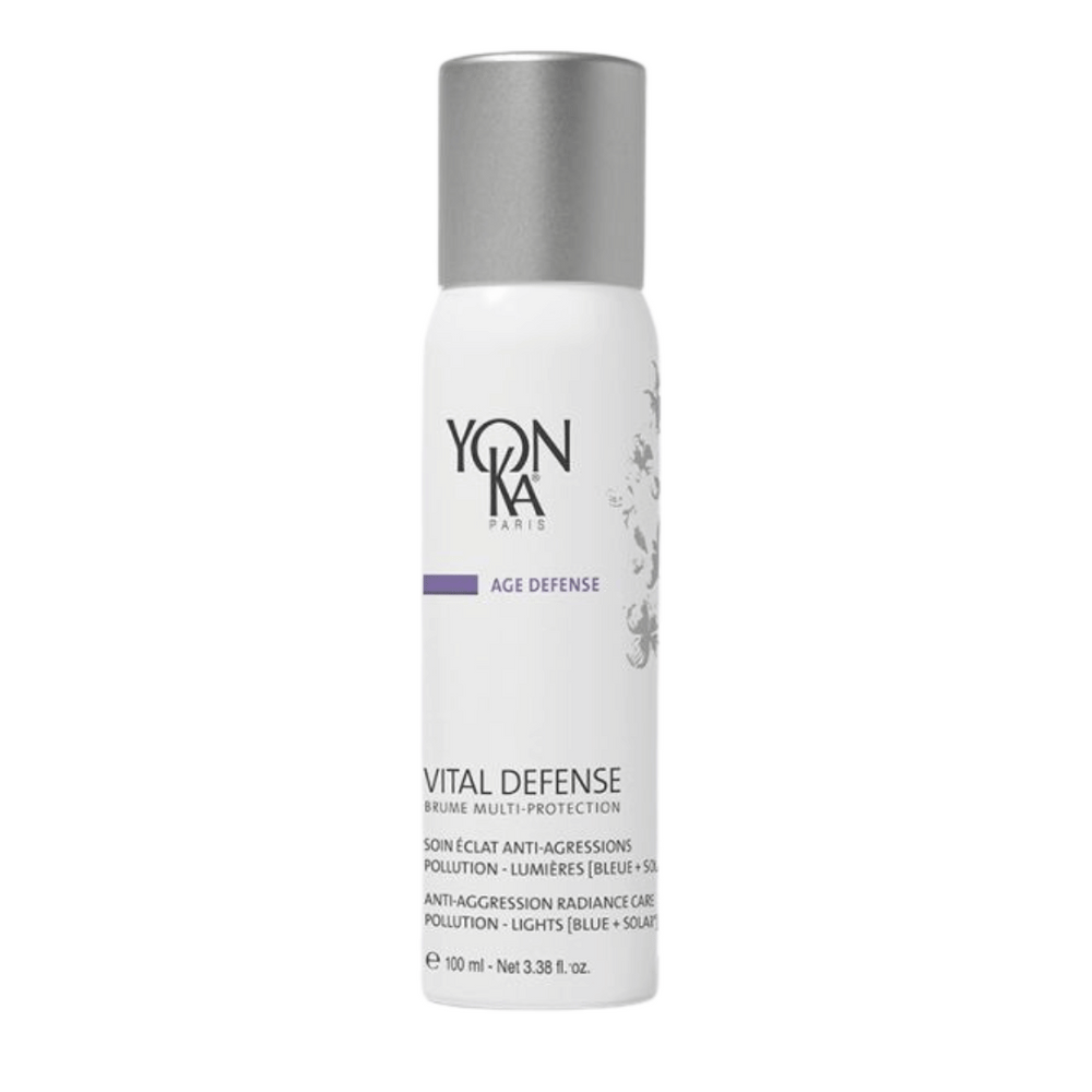 White bottle with silver cap labeled Vital Defense Mist | Yon-Ka Paris, an anti-aggression radiance care mist for skincare, designed to protect against pollution and light.