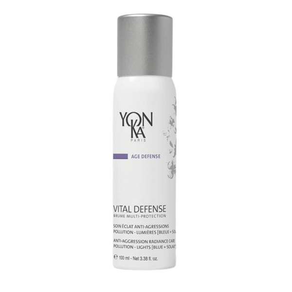 White bottle with silver cap labeled Vital Defense Mist | Yon-Ka Paris, an anti-aggression radiance care mist for skincare, designed to protect against pollution and light.