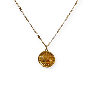 Golden Sunrise Necklace | Meghan Bo featuring a delicate gold chain and round pendant with a sun rising design, symbolizing warmth and new beginnings.