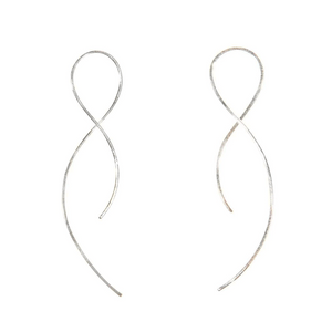 Minimalist silver wire earrings shaped in elegant flowing loops, showcasing the delicate design of Vista Earrings | Purpose Jewelry.