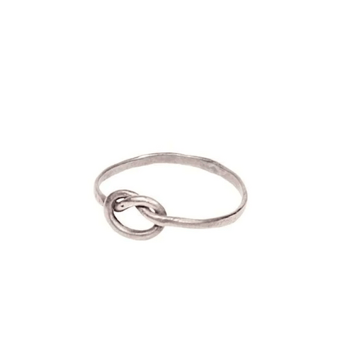 Minimalist silver knot ring with a delicate band design, showcasing the "Knot Ring | Purpose Jewelry" elegance and symbolic style for everyday wear.