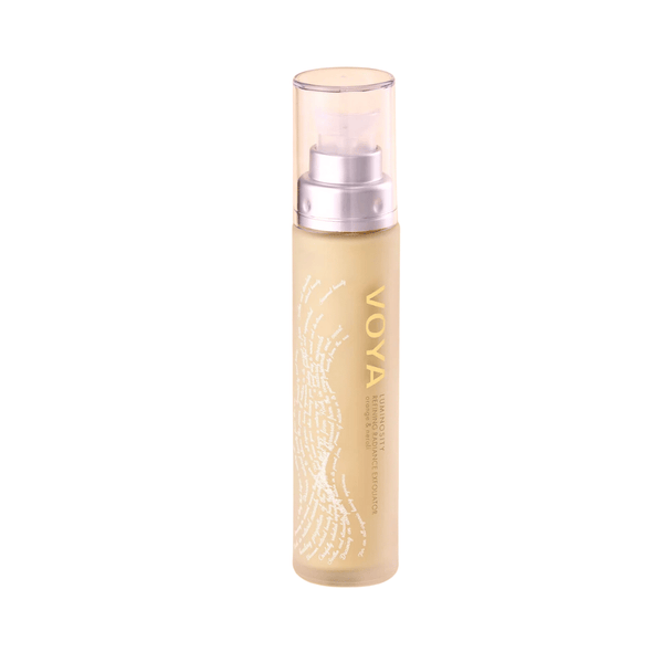 Bottle of Luminosity Refining Radiance Exfoliator | VOYA with a clear pump cap, designed for skincare and body care routine.
