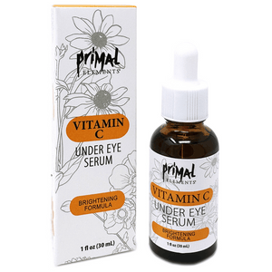Vitamin C Under Eye Serum | Primal Elements bottle with dropper and matching box packaging featuring brightening formula and floral design for skincare.