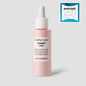 Bottle of Luminant Serum | [ comfort zone ] with dropper cap for skincare, displayed alongside a Marie Claire Skin Awards 2023 winner badge.