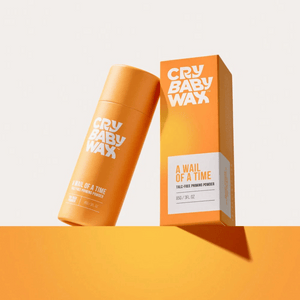 Bright orange packaging of A Wail of a Time Priming Powder | Crybaby Wax with bold white branding against a minimal light background for skincare and beauty wellness.