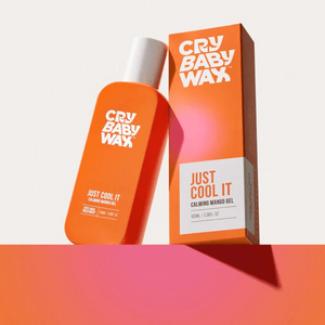 Bright orange bottle and matching box of Just Cool It Calming Mango Gel | Crybaby Wax, a soothing skincare product displayed on a gradient pink and orange surface.