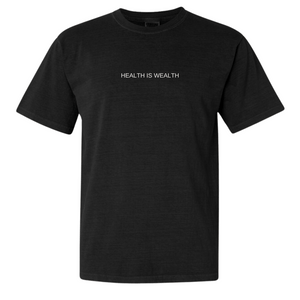 Black crew neck t-shirt with short sleeves featuring the text "HEALTH IS WEALTH" in white, showcasing the Health Is Wealth T-Shirt | Lucky Owl design.
