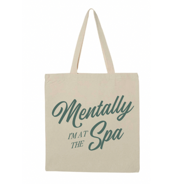 Mentally At The Spa Tote | Lucky Owl featuring a natural canvas tote bag with green script text that reads "Mentally I'm at the Spa," ideal for carrying skincare and wellness essentials.
