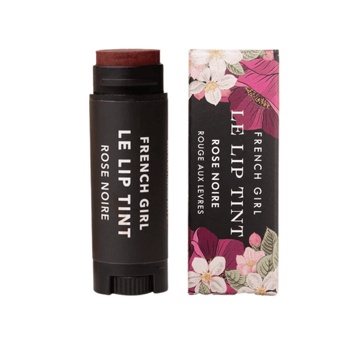 Le Lip Tint | French Girl in a deep rose shade with black tube packaging alongside a floral decorative box, ideal for natural lip color enhancement.