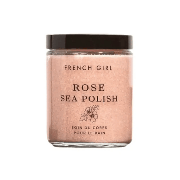 Glass jar of Rose Body Polish | French Girl with a black lid, featuring a pink exfoliating scrub labeled Rose Sea Polish for skincare and body care.