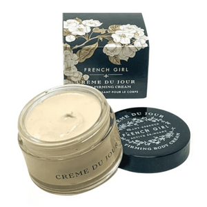 Open jar and black lid of Body Firming Cream | French Girl next to decorative floral packaging box, showcasing light beige creamy skincare product for body care and wellness.